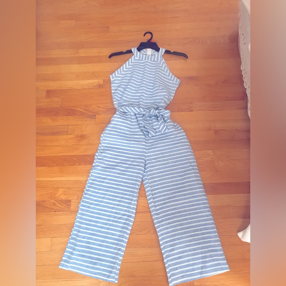 Jump suit. New.  Never worn.  Light blue with a white horizontal strip.  Pretty